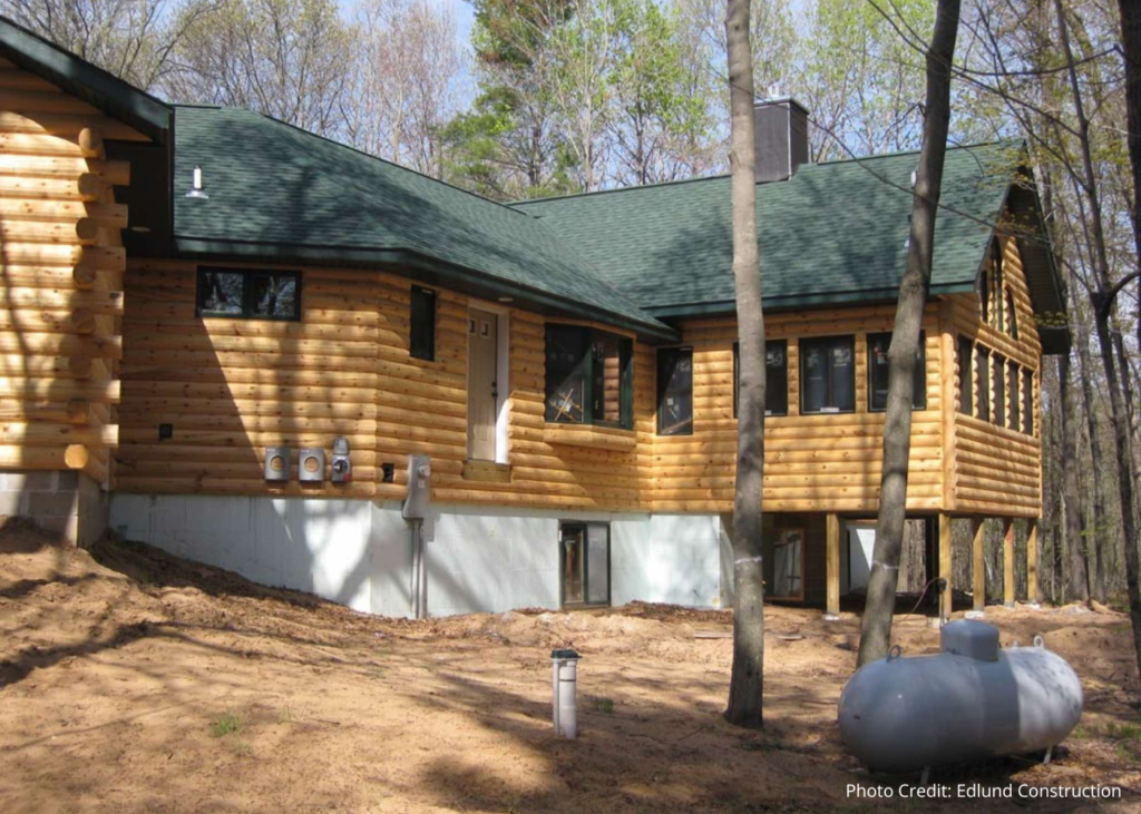 House with half log cladding